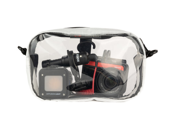 A Tahoma (white with white grid pattern) Halcyon 3D Clear Organizer Cube filled with sundries.